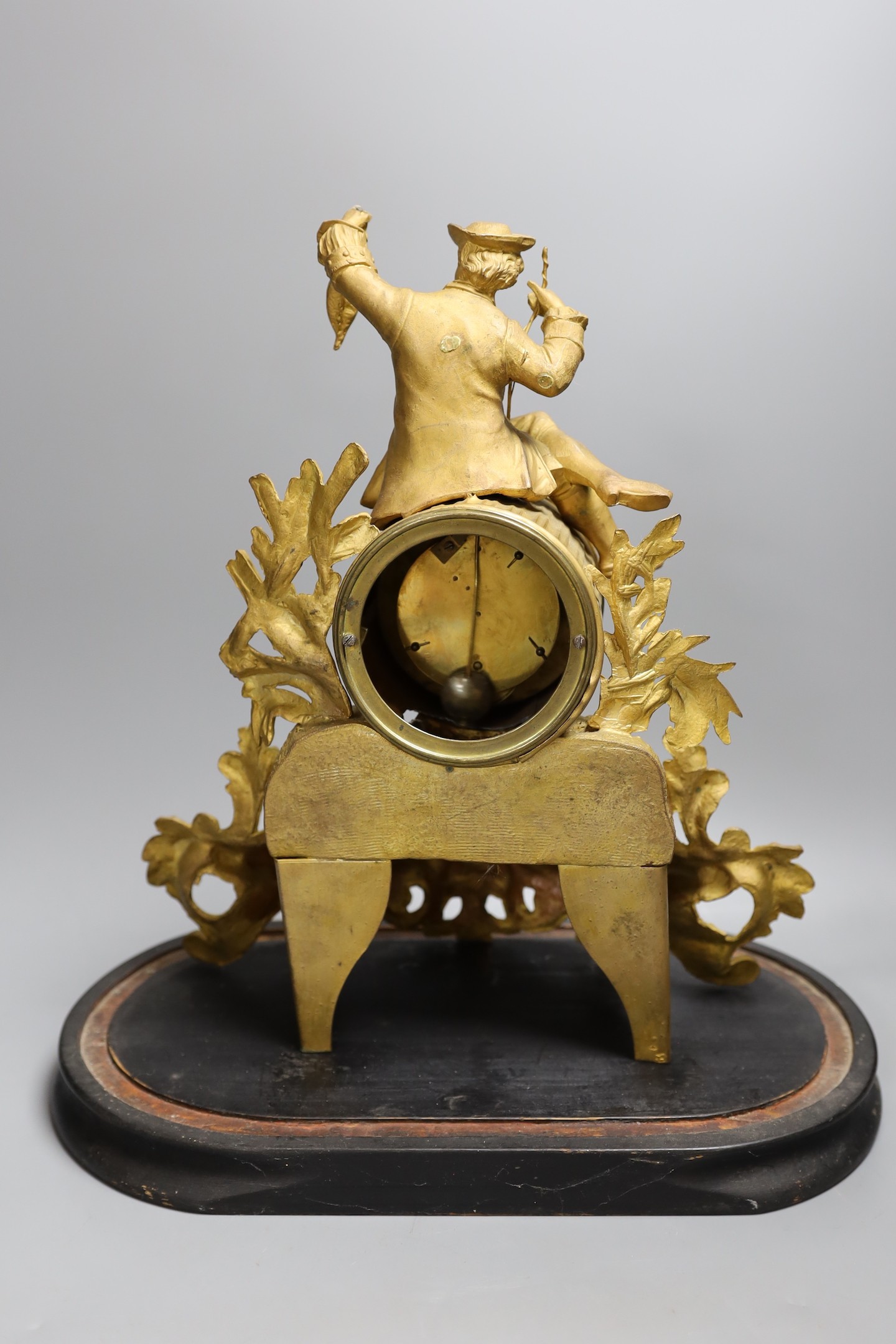 A Victorian gilt spelter mantel clock, under dome, 40 cms high